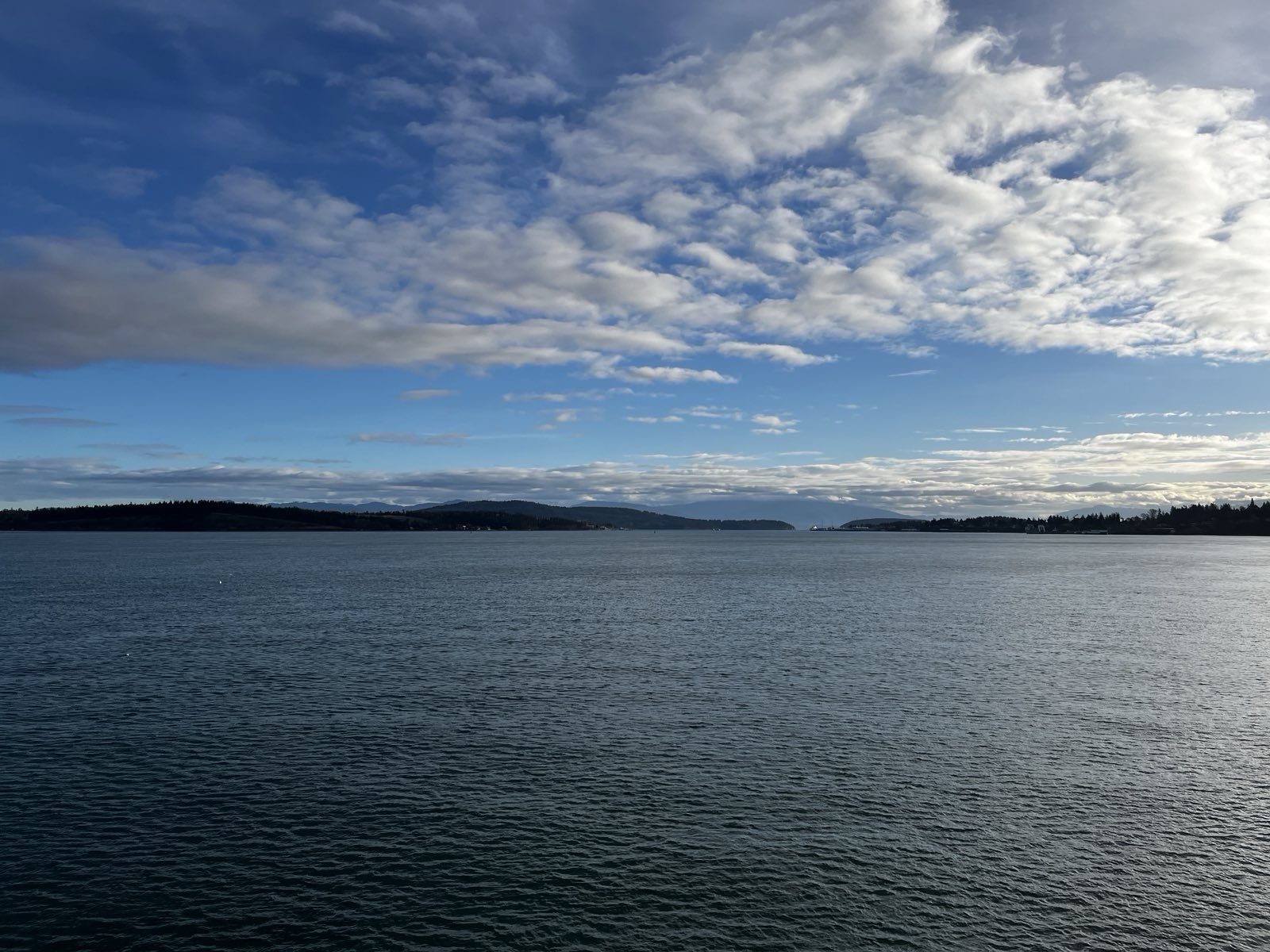 Open water under a wide sky, distant shoreline